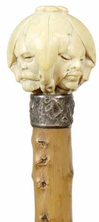 1890-A pierced carved ivory lion handle showing complete detail of the lion, British hallmarked silver metal collar, malacca shaft and a brass H. 4 ½ x 1 ¾, O.L.