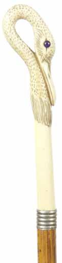 201. Ivory Swan Ca. 1880-A carved ivory swan with glass eyes, silver metal ribbed collar, malacca shaft and a metal H. 1 ¼ x 5 ½, O.L.