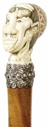 Erotic Ivory Mid 20th Century-An erotic carved ivory handle, ornate silver metal