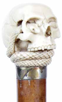 223. Ivory Skull Ca.1900-A folkie carved ivory skull, white metal collar, black malacca shaft and a metal H. 2 x 2,O.L.34 $400-$600 223. 224.