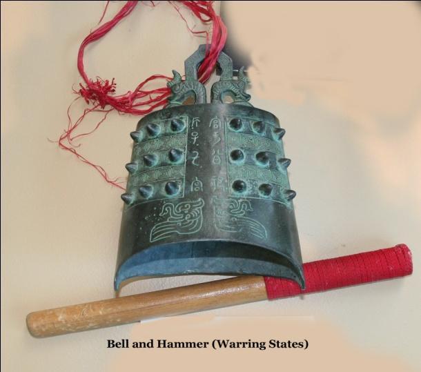 (Bronze Bell (with hammer) The bells do not have a clapper and produce a different sound depending on where they are struck. They are bronze, which is a mixture of copper and tin.