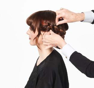 Spray each braid with more Hair Shake and start to pull on each braid to create a voluminous, more texturized braid.