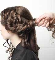 16 Take an area of the hair from the front and loosely hold in