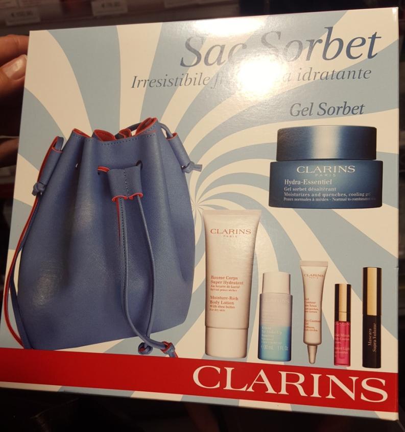 Clarins 1. Clarins saffiano rubber feel drawstring satchel bag with felt lining 2.