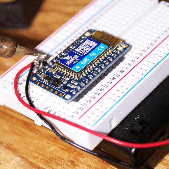 The Bluefruit EZ-Key HID is recommended as it makes this project super simple. For this project the headers were soldered on and the EZ-Key was placed on a breadboard stuck to a 4 AA power supply.