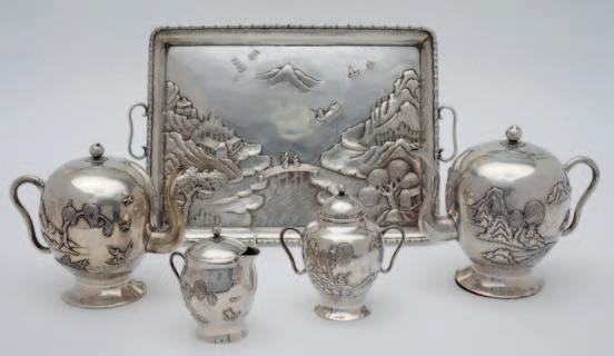 108 A Dutch silver oval pin tray decorated with putti, scrolling foliage and flowerheads, with loop carrying handles to the sides, 18.5cm. wide. 4.14ozs.
