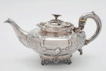 500-600 129 An early Victorian silver teapot, maker Benjamin Reece Dexter, London, 1838, of circular form, embossed with foliate scroll work, scroll handle, the semi-domed cover with an open