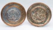 2 2 A pair of late Victorian electrotype plaques, circular form, decorated with classical imagery, signed Mo