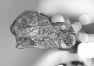 It was found immediately adjacent to Artifact 2-6-S-21a and no other similar piece of glass was found anywhere.