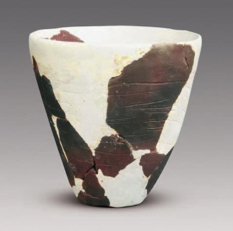 Pottery Jar (T :) Figure 8. Pottery Jar (T :) zigzag patterns on the lower part. It measures.