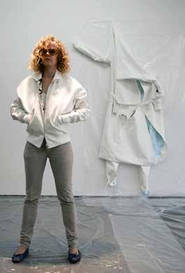 At lest, I hope. b c d BOLLEN / 36. Studio view, 2012. Zhn Clic models the FDIC bomber jcket in front of Jumpsuit with Decortive Security, 2012 b.
