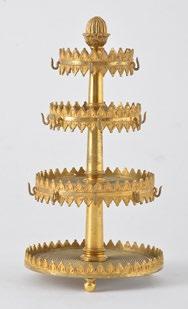 A gilt bronze Charles X ring holder with four levels decorated with a poly-lobed frieze and resting on three rounded feet. France, 19th c.