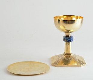 5 29 Vermeil, silver and metal chalice with a baluster stem and a base set with a tri-lobed latin cross. H: 23.5cm - 9.25 Also included a paten.
