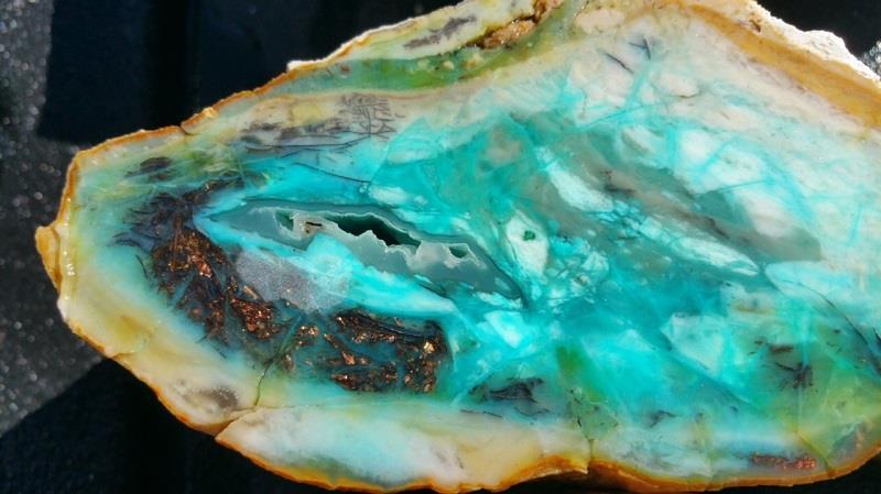 Petrified Wood with Blue Opal was first found as pebbles and larger rounded stones ( cobbles ) in streams and near the slopes of three volcanoes in Indonesia s West Java Province.