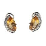 1142 EARRINGS: 18k white gold earrings; (2) fantasy cut citrine, 13.6mm x 7.6mm = an estimated 2.95 total carat weight; (20) round brilliant cut diamonds, 1.6mm = an estimated 0.