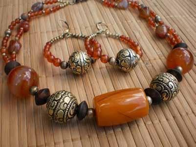 Brazilian Sunset Huge African Amber bead and various shapes of Carnelian, dark Sono
