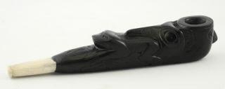 $450 - $500 451 Carved argillite and bone pipe attributed to Moses