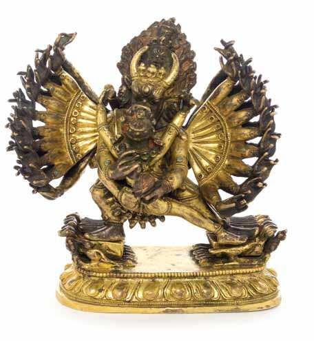 492 493 490 a Sino-tibetan Gilt Bronze Figure of tara the deity depicted seated on a double-lotus plinth, her right hand raised, wearing a dhoti and the bare upper body embellished with beaded