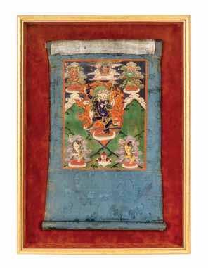 $500-700 516 a tibetan thangka 19tH CEntUrY painted depicting Yama holding bhavacakra wearing a tiara of skulls with a Buddha igure on the upper right