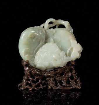 593 595 595* a Finely carved Pale celadon Jade melon Group 18tH CEntUrY of an even colored stone with minor white inclusions and small russet areas, carved to depict three large melons growing from a