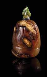613 614 615 618 619 620 613 An Agate Snuf Bottle of lattened, rounded rectangular form, raised on a slight oval foot, carved through the dark brown areas of the semitranslucent stone, on one side