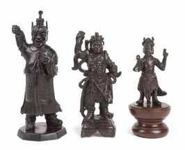 62 a Bronze Figure of a daoist Immortal the igure seated with both hands raised and folded in front of his chest, wearing an elaborate hat. Height 6 5/8 inches.