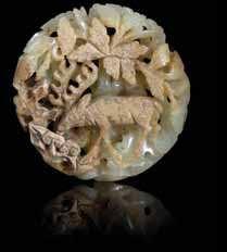 140 two carved Jade Pendants the irst a celadon stone of turtle form, the second of celadon stone with russet inclusions in the form of a deer. Length of larger 2 inches.