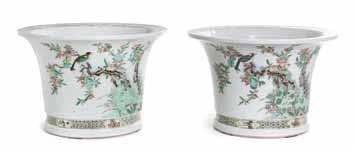 Property from a Canadian Collection $800-1,200 185 a Pair of Famille Verte Porcelain duck-form covered Vessels each bird depicted standing on a rectangular base with openworked ruyi shaped windows,