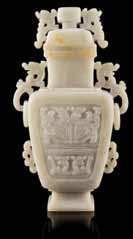 Property from the Collection of a Lady, newport Beach, California $800-1,200 289 a White Jade covered Vase QinG DYnastY of rounded rectangular form with plain sides, the narrow neck carved with a