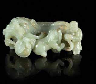 311 310 312 313 314 315 310 a White Jade Sword Slide of rectangular form, carved to the top shaft with C-scroll decoration. Length 4 inches.