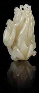 327 a carved celadon Jade toggle LatE QinG DYnastY in the form of a Buddha s hand citron, the stone of even color. Length 2 1/8 inches.