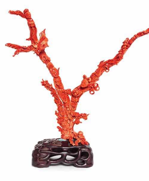 363 a red coral carving of naturalistic form with multiple twigs. Height 9 1/4 inches.