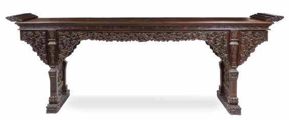 399 401 400 399 a massive chinese hardwood altar table, Qiaotou an the rectangular top lanked by a pair of everted terminals, above a recessed waist and shaped aprons inely carved with lingzhi