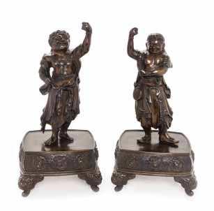443 442 443a 444 442 a Pair of Bronze Guardian-Form candle holders MEiJi PErioD each igure standing on rectangular base raised on four beast mask feet, wearing draped dhoti with a lowing scarf, one