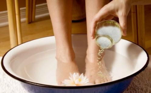 Add 1/4th cup of baking soda to 8 cups of lukewarm water and add the juice of 1 whole lemon to it. Soak your feet in this infusion for 20 minutes and then dry your feet.