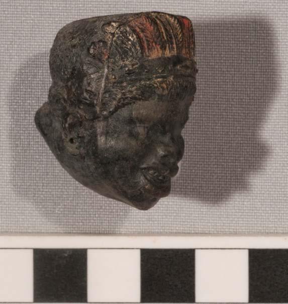 The black ball clay bent pipe was the most significant with the bowl carefully moulded as the head of an indigenous American woman.