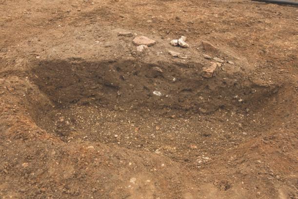 a) b) Excavated Slot 0 5 Archaeological Feature