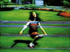 Footage of the artist chanting the title (a line adapted from The Beatles song Happiness is a Warm Gun) is replayed at high and low speeds, with obscuring video effects, blurring into an almost