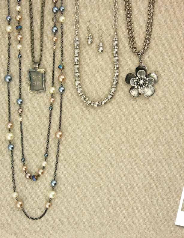 JN0508 $32 Intricately designed beads and a hint of sparkle make this substantial necklace set special! 17-20 Earrings hang 1 ½ JN0270 $34 Antiqued silver tone flower and chain necklace 17-20 b. a. a. JN0621 $39 Two long strands of delicate hematite chain, crystals, and pearls in hues of grey, champagne, and crème 37 long with 3 extender b.