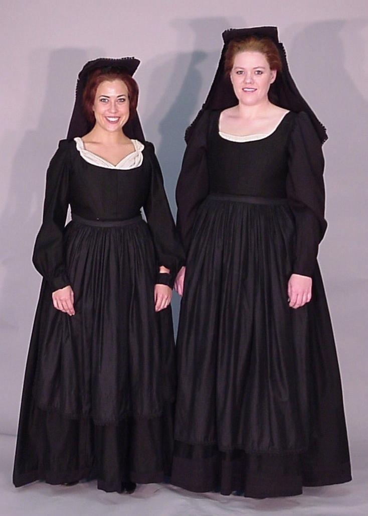 Peasants Black dress with long sleeves and white collar