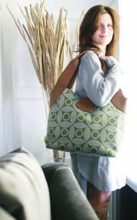Organic cotton, leather handles and piping, interior pockets (including bottle pockets) and