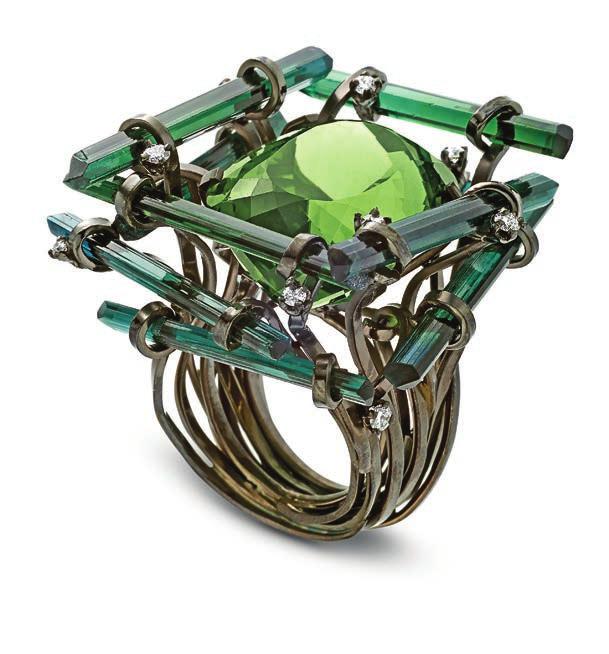From the Jumanji collection is a gold ring featuring a scaffolding of tourmalines. Satellite ring set with pearl and diamonds.