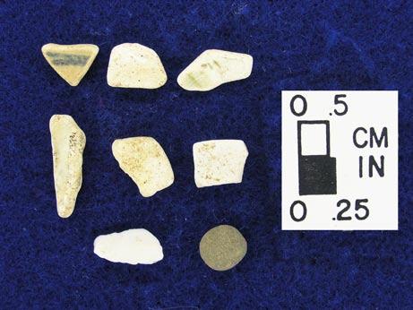 The glass items consist of aqua, amber, clear, and possibly milk glass and are all triangular. Glass items were recovered only from Site 44LD538. The stone items vary the most in size and shape.