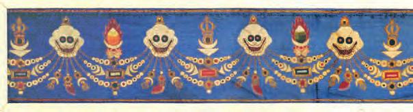 9 A horizontal embroidered silk panel, made for a buddhist temple, the sky blue ground worked with skulls and pendants of jewels under a half vajra, or