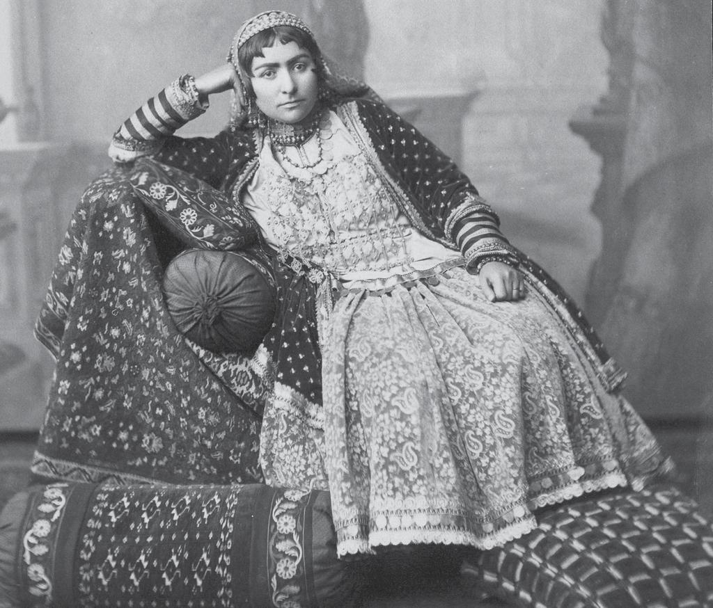 Following tradition Women s folk clothes. Photo of the early 20th century a double-breasted arkhalig, the appearance of which was apparently influenced by Russian military uniforms, became widespread.