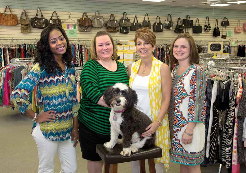 The friendly staff at Designers 2nd Debut, including mascot Abbey, look forward to your next visit. and earns cash or store credit for the owner via a consignment agreement with the store.