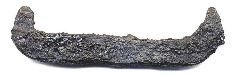 several fragments displayed side, suggesting that something made of iron may have been placed in the pot or in the immediate vicinity of it.