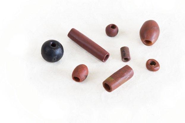 Many beads, such as those shown to the right, were carved and drilled without benefit of metal tools, likely utilizing only sandstone and water in the grinding process.