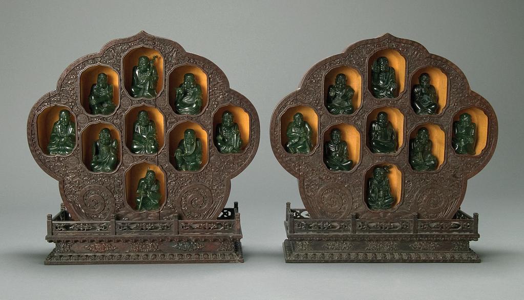 A Pair of Rare Zitan Wood Box Shrines with Eighteen Spinach Jade Lohans, from the Qing Dynasty The fine wood carving of these boxes is very good, showing symbols for longevity, with ruyi surrounding