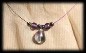 Caroline necklace Hematite pearls mounted on steel wire sheathed, silver colour.